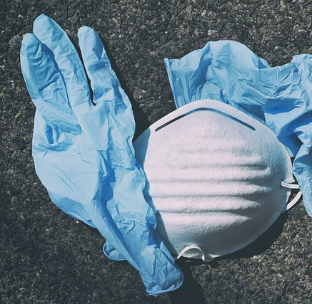 Gloves and face mask on the ground